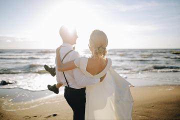 bride and groom on beach